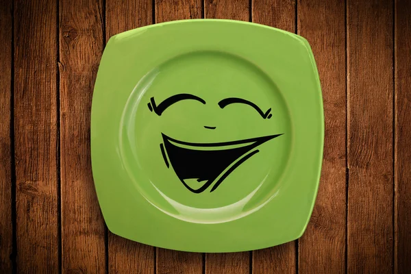 Happy smiley cartoon gezicht op kleurrijke schotel — Stockfoto
