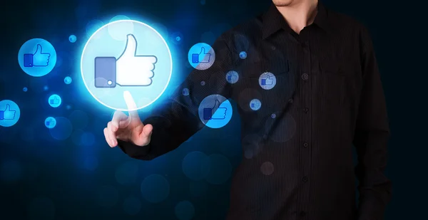 Handsome person pressing thumbs up button on modern social netwo — Stock Photo, Image