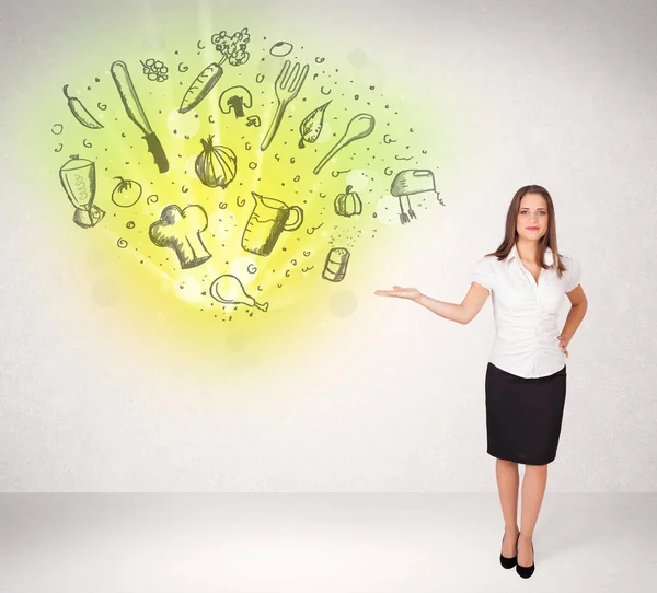 Young girl presenting nutritional cloud with vegetables — Stock Photo, Image