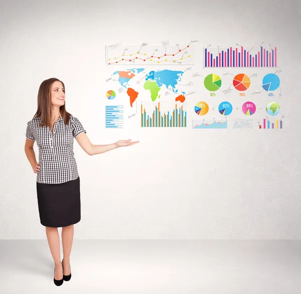 Business woman with colorful graphs and charts — Stock Photo, Image