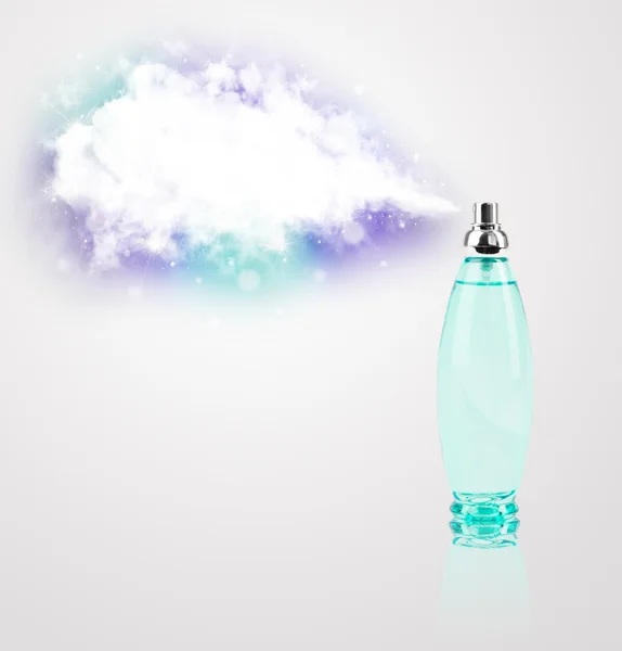 Beautiful bottle spraying colorful cloud — Stock Photo, Image