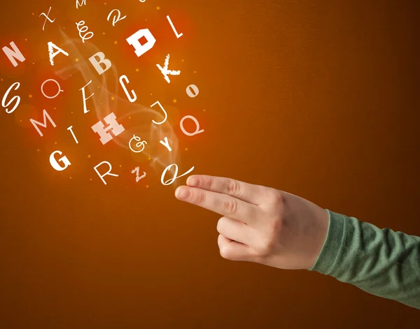 Letters coming out of gun shaped hands — Stock Photo, Image