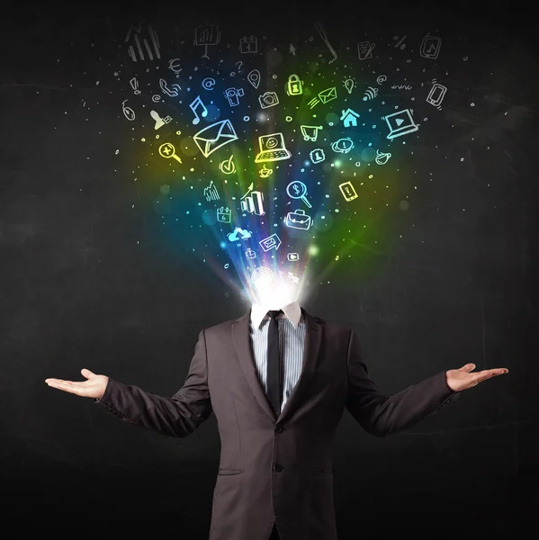 Business man with glowing media icons exploding head — Stock Photo, Image