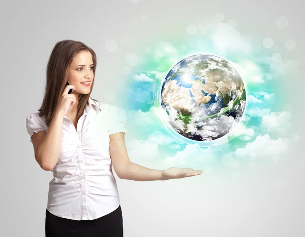 Young woman with earth and cloud concept — Stock Photo, Image