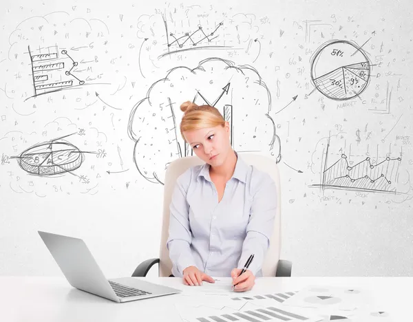 Business woman sitting at table with hand drawn graph charts — Stock Photo, Image
