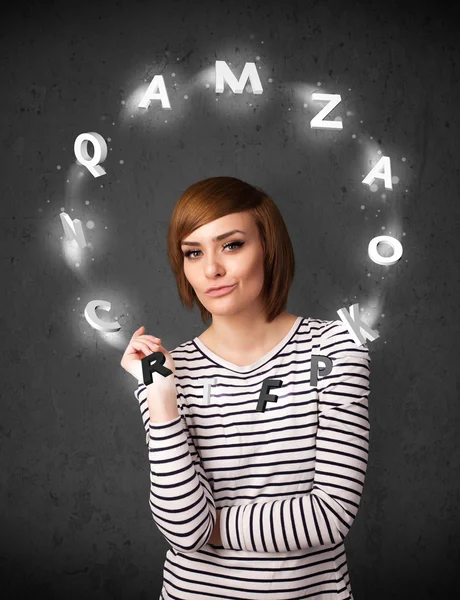 Young woman thinking with letter circulation around her head — Stock Photo, Image