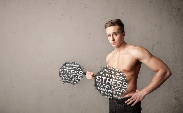 Muskulös man slåss med stress — Stockfoto