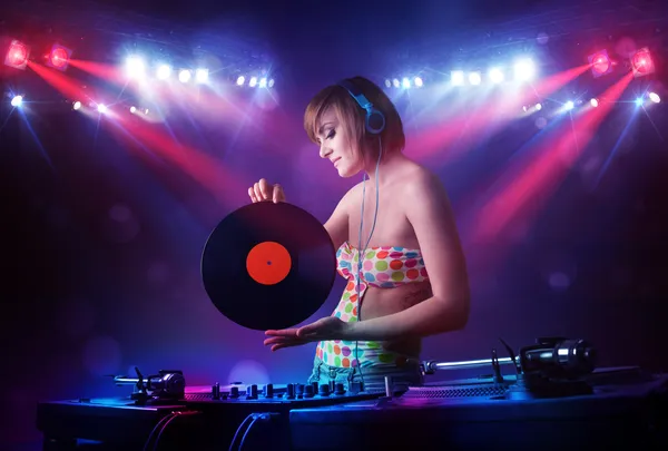 Teenager Dj Mixing records in front of a crowd on stage — стоковое фото
