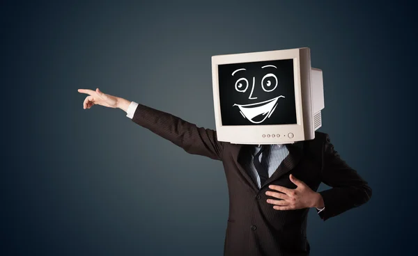 Gelukkig zakenman met een PC monitor hoofd en een smiley gezicht — Stockfoto