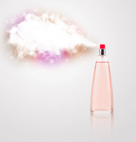 Beautiful bottle spraying colorful cloud — Stock Photo, Image