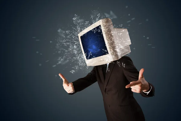 Computer monitor screen exploding on a young persons head — Stock Photo, Image