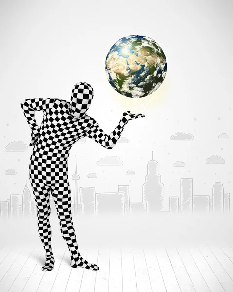 Man in full body suit holding planet earth — Stock Photo, Image