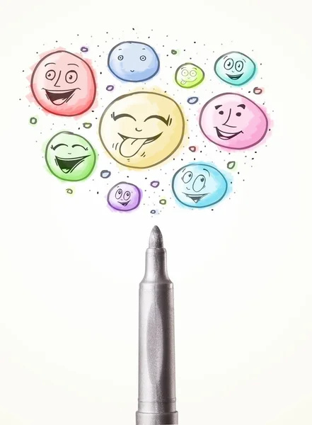 Smiley faces coming out of felt pen — Stock Photo, Image