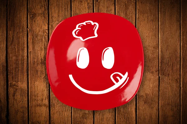 Happy smiley visage de dessin animé sur plaque de plat coloré — Photo