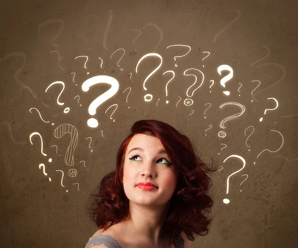 Girl with question mark symbols around her head — Stock Photo, Image