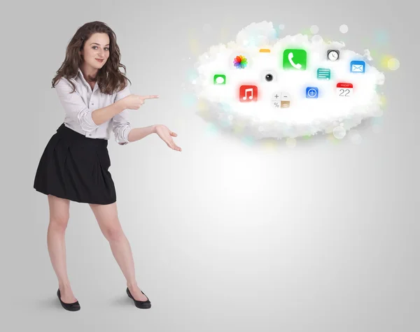 Young woman presenting cloud with colorful app icons and symbols — Stock Photo, Image