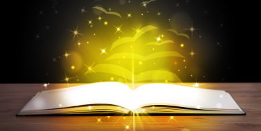 Altından parlak uçan kağıt sayfaları olan açık bir kitap