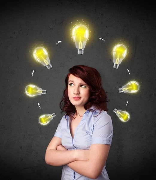 Young woman thinking with lightbulb circulation around her head — Stock Photo, Image