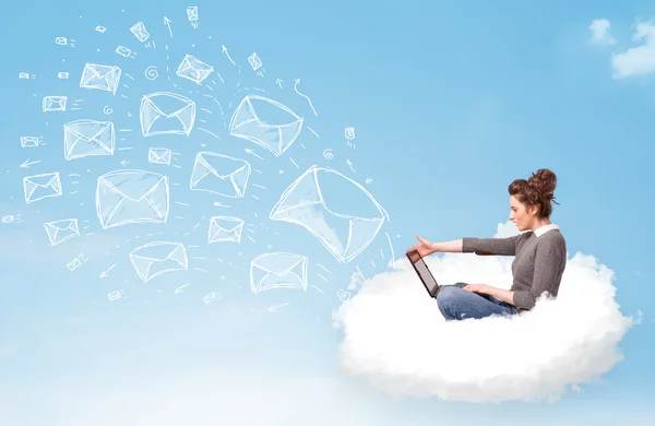 Young woman sitting in cloud with laptop — Stock Photo, Image