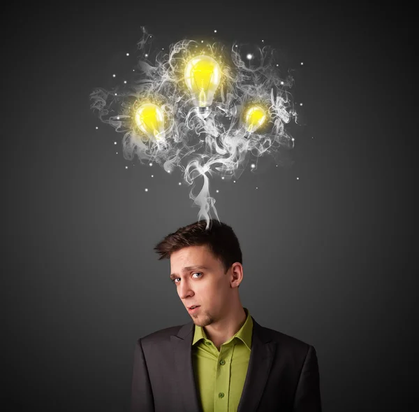 Thoughtful businessman with smoke and lightbulbs above his head — Stock Photo, Image