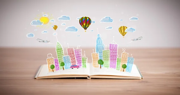 Cityscape drawing on open book — Stock Photo, Image