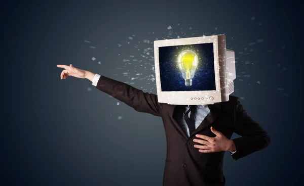 Business man with a pc monitor head and idea light bulb in the d — Stock Photo, Image