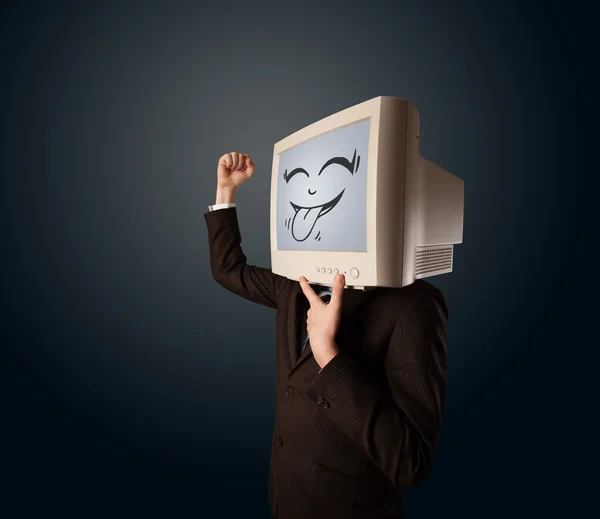 Hombre de negocios feliz con un monitor de computadora y una cara sonriente —  Fotos de Stock