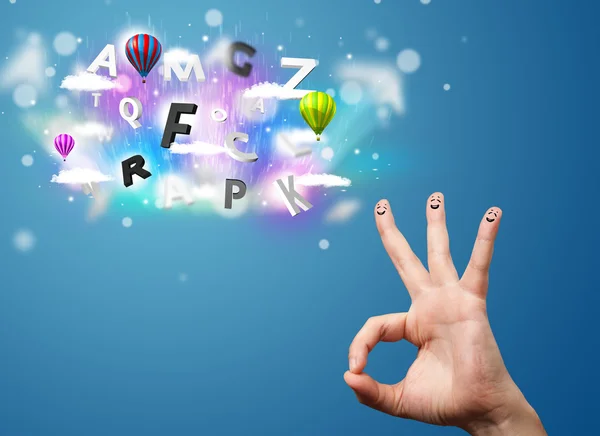 Happy smiley fingers looking at colorful magical clouds and ball — Stock Photo, Image