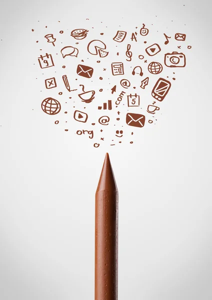 Crayon close-up with social media icons — Stock Photo, Image