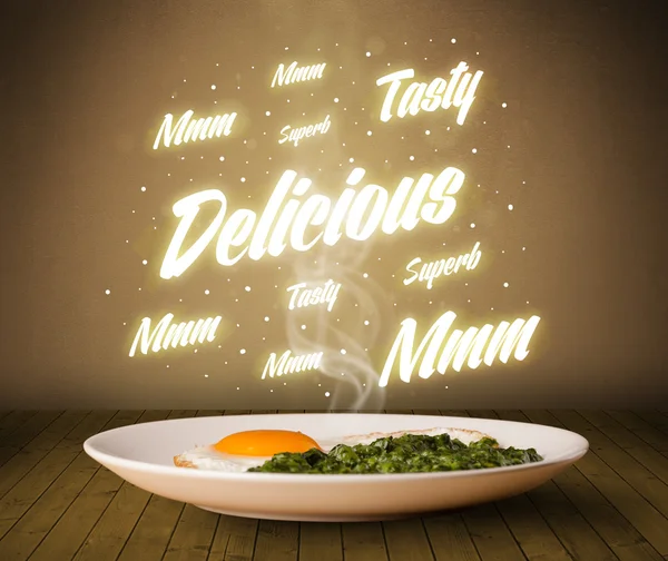 Food plate with delicious and tasty glowing writings — Stock Photo, Image