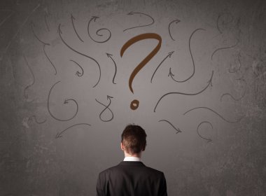 İş adamı soru işareti skecine bakıyor.