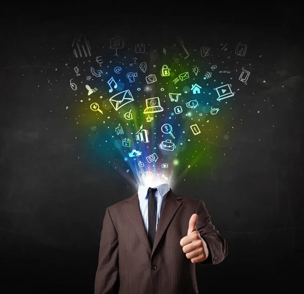 Business man with glowing media icons exploding head — Stock Photo, Image