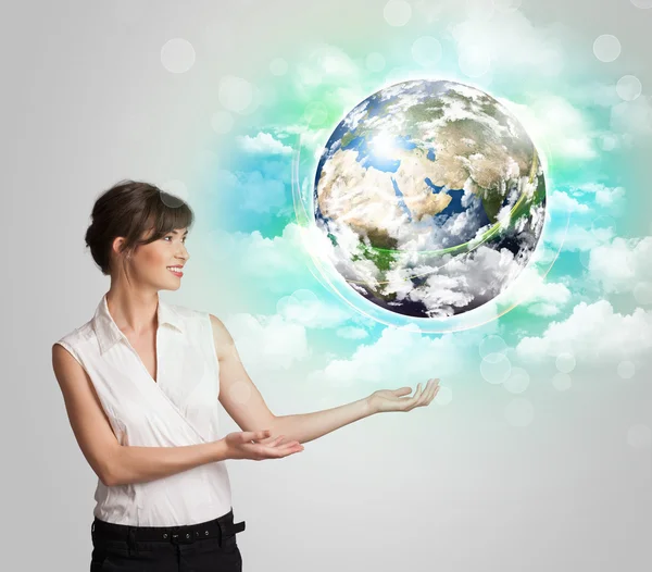 Young woman with earth and cloud concept — Stock Photo, Image