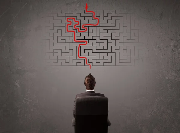 Business man looking at a maze and the way out — Stock Photo, Image