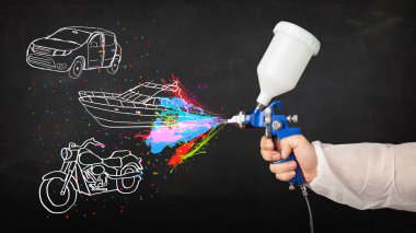 Man with airbrush spray paint with car, boat and motorcycle draw clipart