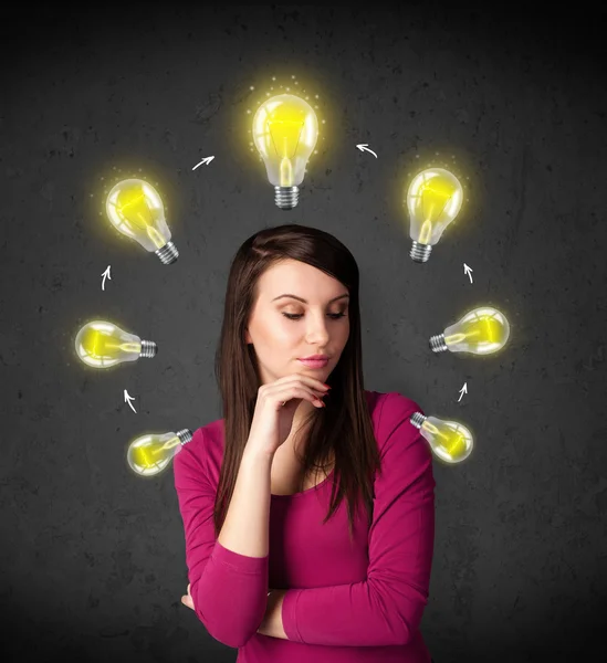 Young woman thinking with lightbulb circulation around her head — Stock Photo, Image