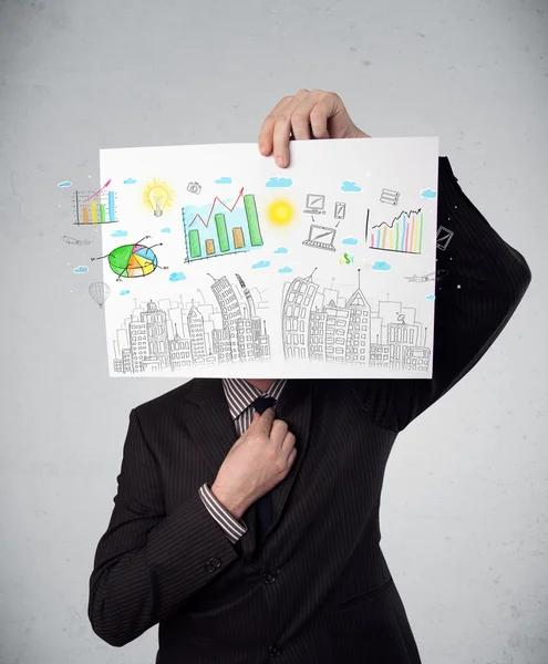 Businessman holding a paper with charts and cityscape in front o — Stock Photo, Image