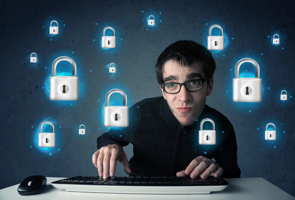 Young hacker with virtual lock symbols and icons — Stock Photo, Image