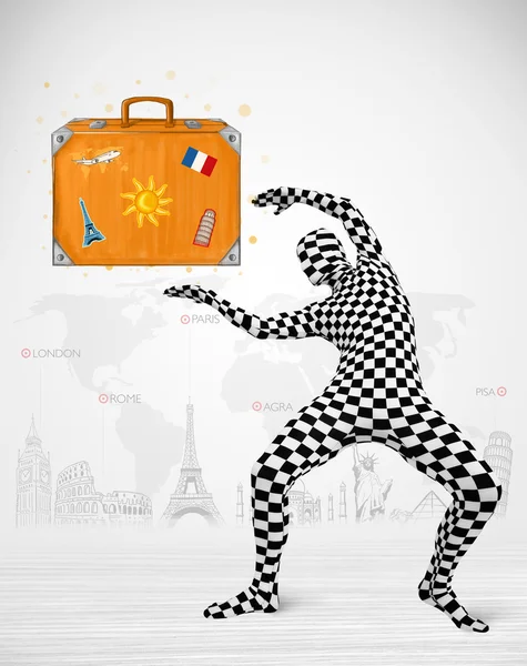 Man in full body suit presenting vacation suitcase — Stock Photo, Image