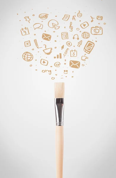 Brush close-up with social media icons — Stock Photo, Image