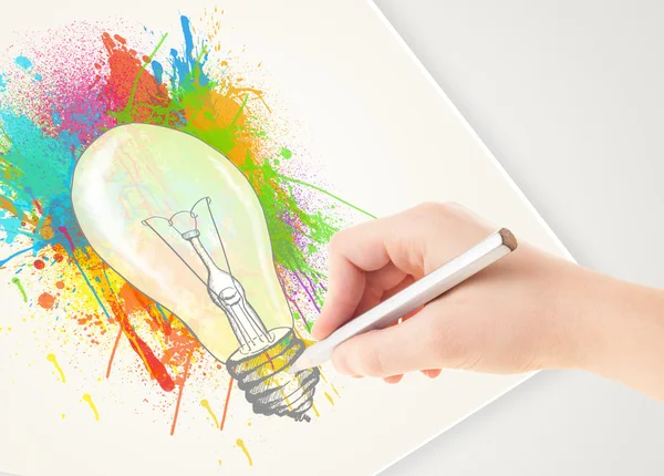 Hand drawing on paper a colorful splatter lightbulb — Stock Photo, Image