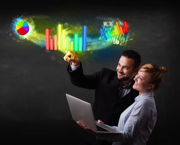 Young business couple touching colorful modern graph system conc — Stock Photo, Image