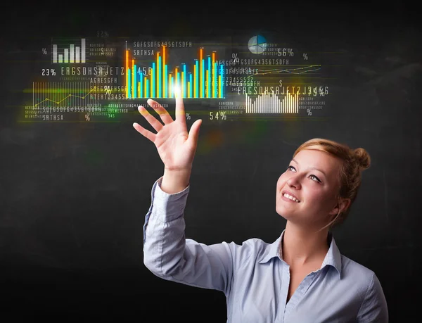 Young business woman touching colorful charts and diagrams — Stock Photo, Image