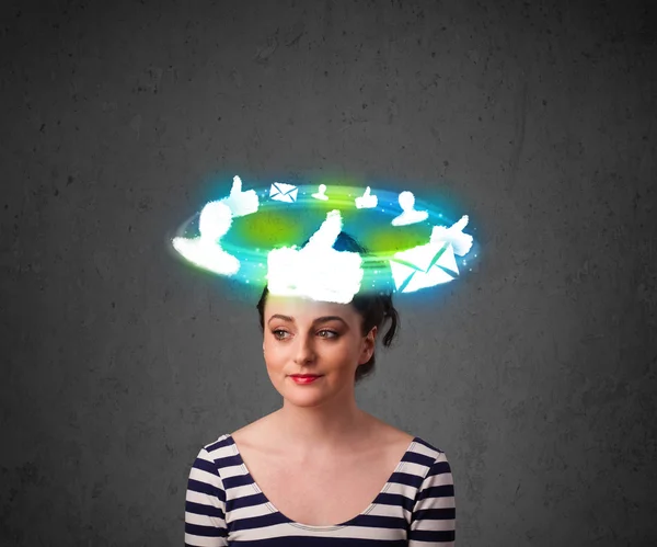 Young teenager with cloud social icons around her head — Stock Photo, Image