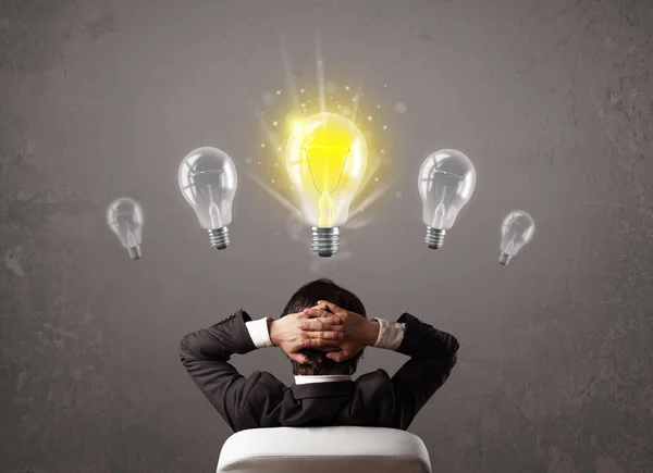 Business person having an idea light bulb concept — Stock Photo, Image