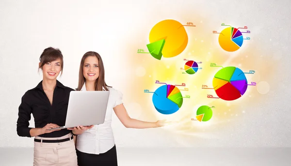 Business woman with colorful graphs and charts — Stock Photo, Image