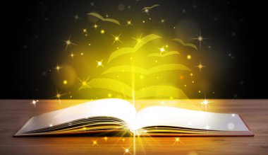 Altından parlak uçan kağıt sayfaları olan açık bir kitap