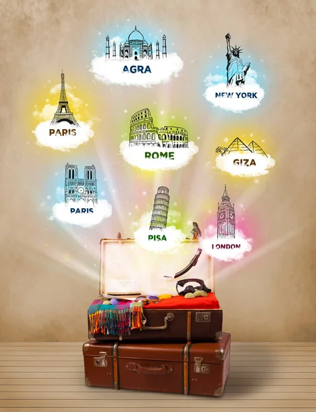 Tourist suitcase with famous landmarks around the world — Stock Photo, Image