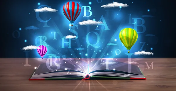 Open book with glowing fantasy abstract clouds and balloons — Stock Photo, Image