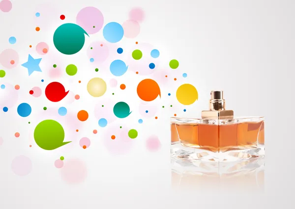 Perfume bottle spraying colored bubbles — Stock Photo, Image
